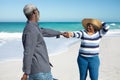 Old couple having fun at the beach Royalty Free Stock Photo