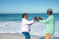 Old couple having fun at the beach Royalty Free Stock Photo