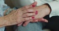 Old couple holding hands. Close-up of hands of lovely aged couple caring and loving each other. Support trust in Royalty Free Stock Photo
