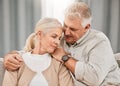 Old couple, hug and relax on sofa with empathy and support, bonding while at home with trust and comfort. People with Royalty Free Stock Photo
