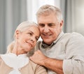 Old couple, hug and relax on sofa with love and support, bonding while at home with trust and comfort. People with time Royalty Free Stock Photo