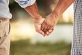 Old couple, love and holding hands for support in nature, park or outdoors walk. Retirement, romance and elderly, man Royalty Free Stock Photo
