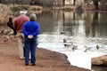 Old couple at pond Royalty Free Stock Photo