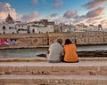 Old couple relaxing together near the Italian sea