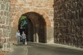 Old couple at the San Vicente Gate on the wall of Avila