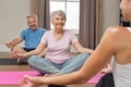 Old couple sitting in lotus position