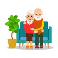 Old couple sitting. An older man and woman are sitting on sofa and rest. Concept of leisure retirees. Happy grandparents together