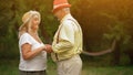 Old Couple Standing Sideways And Holding Their Hands Royalty Free Stock Photo