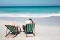 Old couple taking photos at the beach Royalty Free Stock Photo