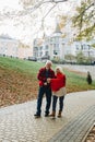 Old couple is walking in the green park. Fifty years together love story. Grandma and grandpa kissing. Grandmother and grandfather Royalty Free Stock Photo