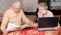 Old couplen reading hot news Royalty Free Stock Photo