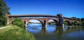 The old covered bridge over the TIcino River in Pavia Royalty Free Stock Photo