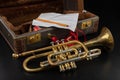 Old covered patina trumpet in a case. A historic wind musical instrument and a suitcase Royalty Free Stock Photo