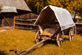 Old covered wagon in the courtyard of a Romanian village Royalty Free Stock Photo