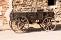Old covered wagon outside western building Royalty Free Stock Photo