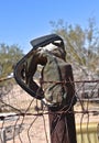 Western cowboy boot hanging on a post Royalty Free Stock Photo