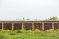 Old cowshed. Large wooden gate and dried wood. Old brick building Royalty Free Stock Photo