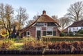 Old cozy house with thatched roof in Giethoorn, Netherlands.