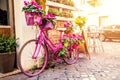 Old cozy street in Trastevere, Rome, Italy with a purple bicycle