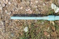 Old crack blue pipe on the ground Royalty Free Stock Photo