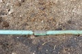 Old crack blue pipe on the ground Royalty Free Stock Photo