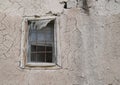 Old cracked adobe wall with window Royalty Free Stock Photo