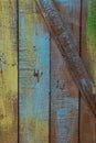 Old cracked boards with peeling and cracks, randomly painted in different colors. Royalty Free Stock Photo