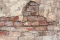 Old cracked brick wall with cement surface Royalty Free Stock Photo