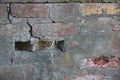 Old cracked brick wall of the house