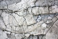 Old cracked concrete grey wall with breakaway pieces