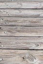 Old, cracked, faded timber planks with tree nails and knothole Royalty Free Stock Photo