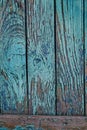 Old cracked fence with blue shabby paint Royalty Free Stock Photo