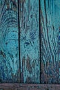 Old cracked fence with blue shabby paint Royalty Free Stock Photo
