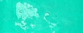 Old cracked mint wall. Painted texture background in trendy turquoise color. Banner. Trendy green and turquoise color
