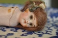 Old and cracked porcelain doll