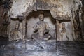 Old cracked sculptures in Yungang Grottoes, China