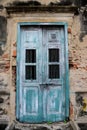 Old cracked wall with bule door ,Old brick wall