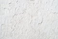 Old cracked wall covered white plaster, background Royalty Free Stock Photo