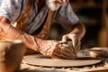 Old craftsman working on pottery wheel while sculpting from clay. Generative AI Royalty Free Stock Photo
