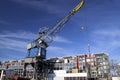 Old crane in harbor named Leuvehaven in downtwon Rotterdam on sunny day