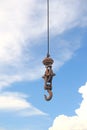 Old crane hook against a blue sky Royalty Free Stock Photo