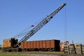 Old crane loading a a car on the railroad Royalty Free Stock Photo