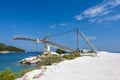 Old Crane near Marble Beach and Quarry Royalty Free Stock Photo