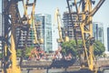 Old cranes in Puerto Madero Waterfront district. Modern skyline