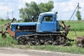 Old crawler tractor standing in a field