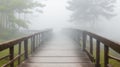 An old, creaky wooden bridge surrounded by mist Royalty Free Stock Photo