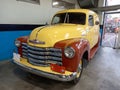 Old cream and brown 1947 Chevrolet Chevy delivery panel van. Classic car show.