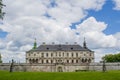 Old creepy huge dark castle surrounded with fence Royalty Free Stock Photo