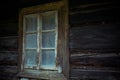 Old creepy scary window on wooden house. Halloween, haunted house concept