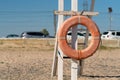 Old Crimea beach saver life preserver protection equipment red sea, for rescue save from belt from sky summer, object Royalty Free Stock Photo